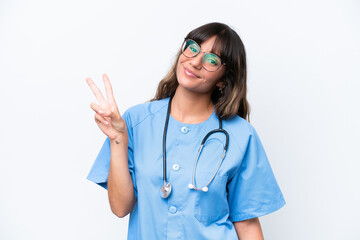 Young caucasian nurse woman isolated on white background smiling and showing victory sign