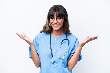 Young caucasian nurse woman isolated on white background with shocked facial expression