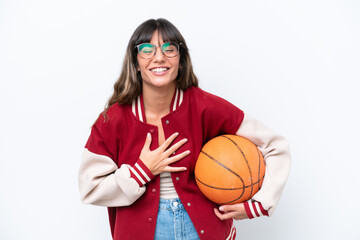 Young caucasian woman playing basketball isolated on white background smiling a lot