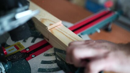 cutting wood with a miter saw. construction tool at work