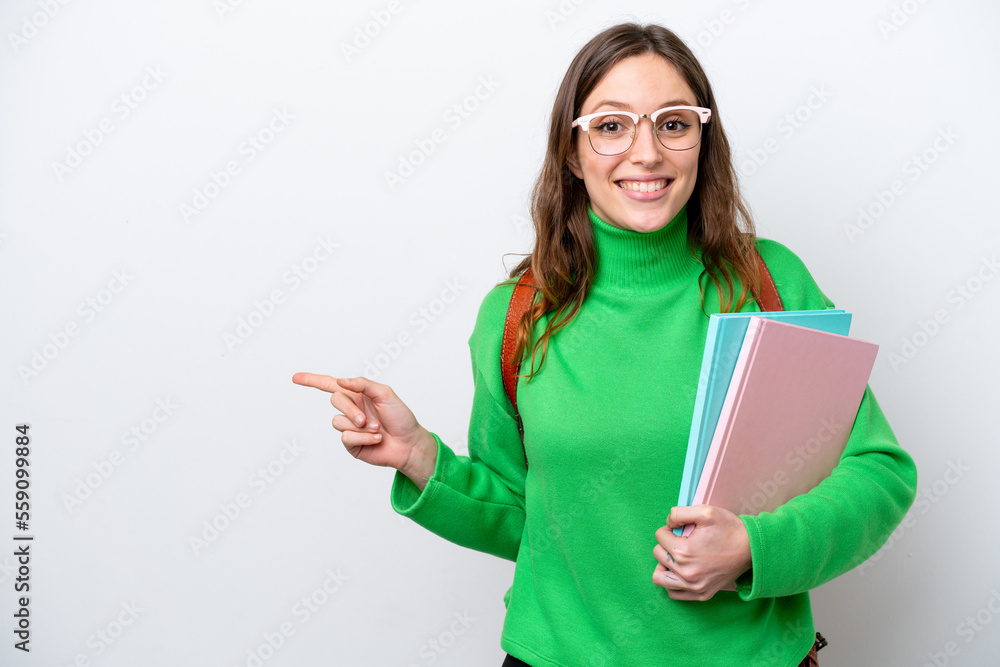 Canvas Prints Young student caucasian woman isolated on white background surprised and pointing finger to the side