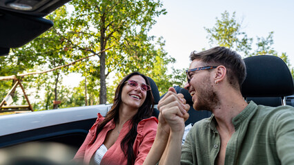 Young couple lovers traveling for valentine’s day, luxury travel and expensive cars, wealthy...