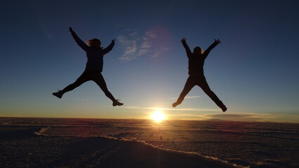 Fototapeta premium people jumping on the Uyuni