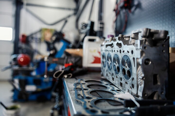 Fototapeta na wymiar Maintenance of engine pistons and car parts at mechanic's shop.