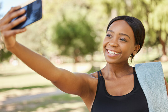 Fitness, phone selfie and black woman in park for workout, exercise and healthy lifestyle. Happy female, sports influencer and athlete taking mobile photograph for social media, wellness and goals