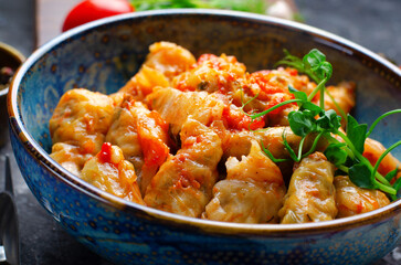 Homemade Cabbage rolls with meat, rice and vegetables also known as sarma, golubtsy, dolma on Rustic Background