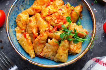 Homemade Cabbage rolls with meat, rice and vegetables also known as sarma, golubtsy, dolma on Rustic Background