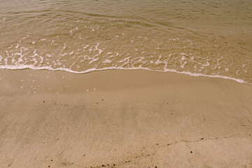 background of clean beach sand and sea water.