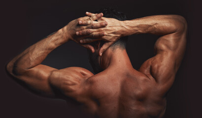 Man, body or back muscle on black background in studio fitness goals, workout or training...