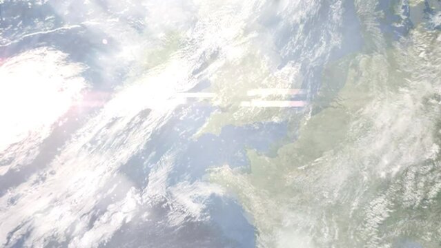 Earth zoom in from outer space to city. Zooming on Exeter, UK. The animation continues by zoom out through clouds and atmosphere into space. Images from NASA