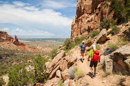 Hikers descend Wedding Canyon Trail in Colorado National Monument