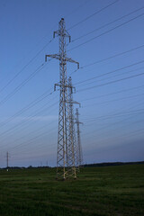 Power line towers against the sky. Towers of high voltage power lines. - 559116069