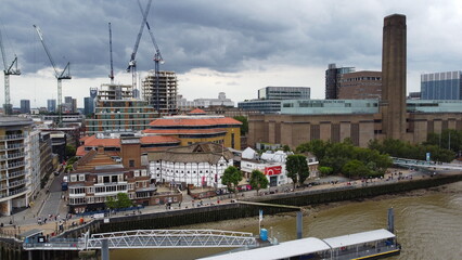 Globe theater London buildsite in background with tower cranes