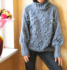 Handmade knitted winter sweater ,woman in knitted clothes	