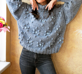 Handmade knitted winter sweater ,woman in knitted clothes	