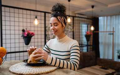 woman beautiful young female sit at the kitchen table have breakfast