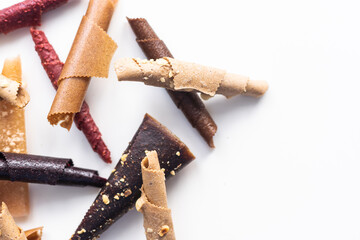 Natural and healthy snack food - fruit pastille from apples, raspberry and currant on a white background. Fruit Marshmallow