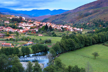 Fototapeta na wymiar Beautiful landscape of Alvoco das Várzeas in Portugal, seen at dusk with the river, the weir and the agricultural fields in the foreground.