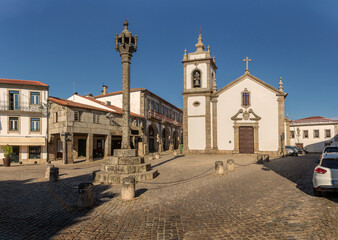 View of the pillory and church of Saint Peter in the historic center of the city of Trancoso in Portugal.