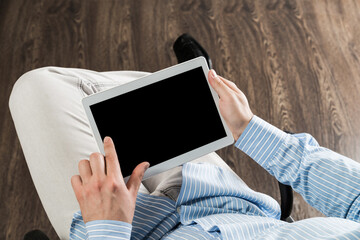 businessman with a tablet, works in the office