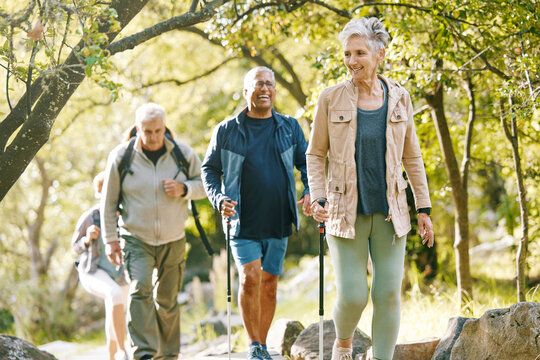 Hiking, elderly and people, happy outdoor with nature, fitness and fun in park, exercise group trekking in Boston. Diversity, friends and happiness with hike, active lifestyle motivation and senior.