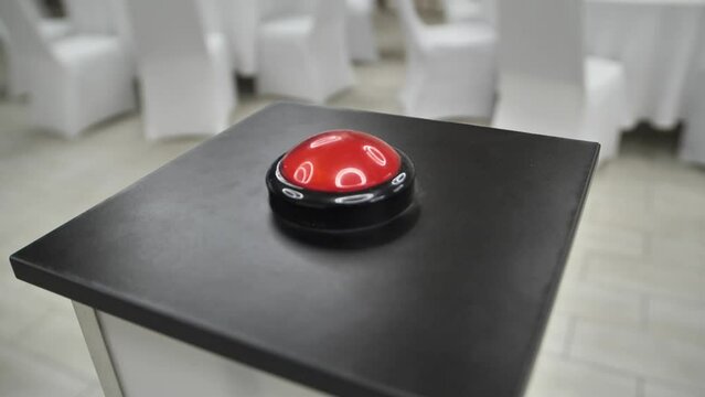 Shooting video around a big round red button.  A game with a big red button.