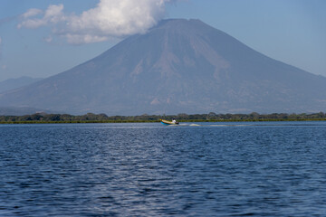 Chaparrastique volcano seen from Laguna Olomega in San Miguel, El Salvador - obrazy, fototapety, plakaty