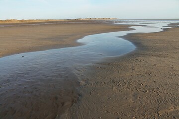 beach in the morning light - tidal water is coming in