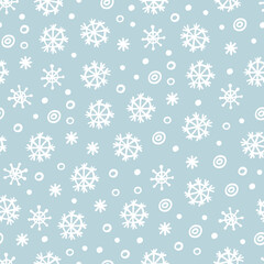 Falling snowflakes Christmas seamless pattern on blue