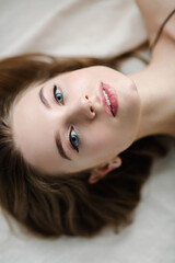 Close-up of a woman's portrait. Beautiful woman with blue eyes. High quality photo