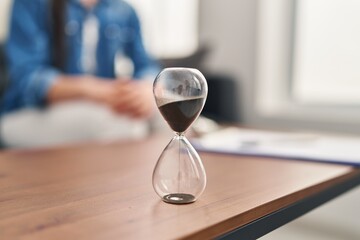 Young beautiful hispanic woman patient having mental therapy sitting on sofa at psychology clinic