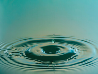 Water drop falling and colliding with another one