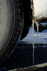 Icicles of ice under a car. Kushiro. Hokkaido. Japan.