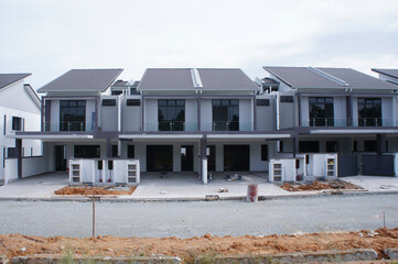SELANGOR, MALAYSIA - JUNE 20, 2022: New double-story terrace house under construction in Malaysia....