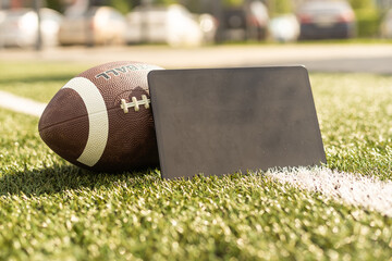 american football ball and tablet.