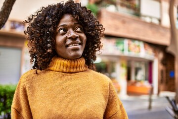 African american woman smiling confident at street