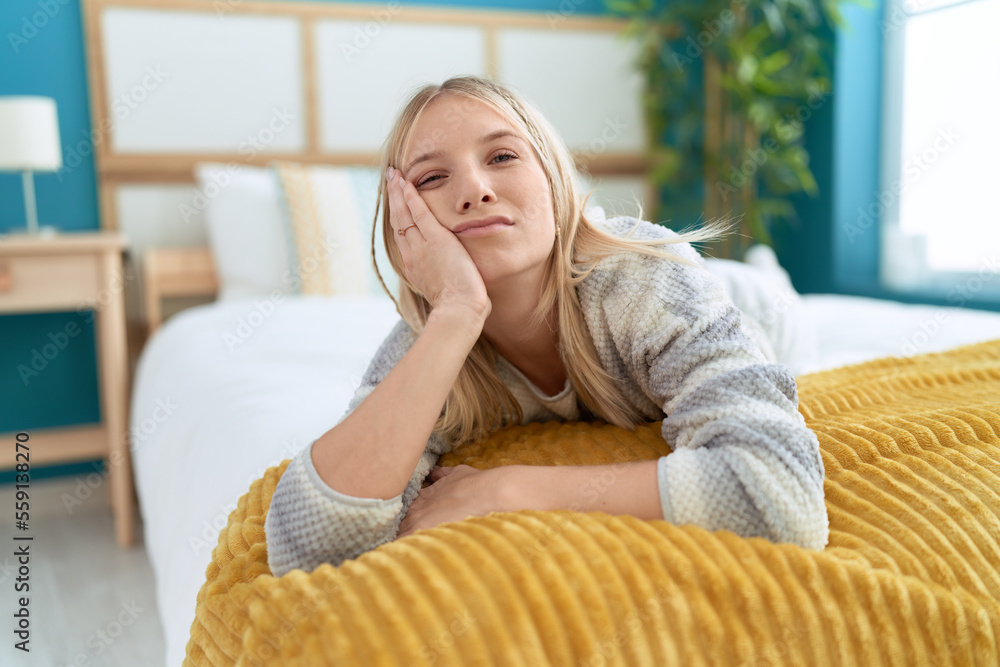 Poster young blonde woman lying on bed sleeping at bedroom