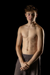 A shirtless 17 year old muscular boy