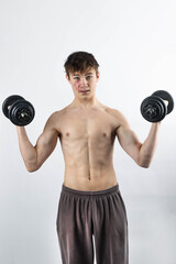 Fototapeta na wymiar A shirtless 17 year old muscular boy