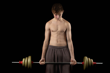 A shirtless 17 year old muscular boy