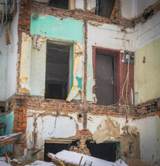 An old ruined building in a snowfall