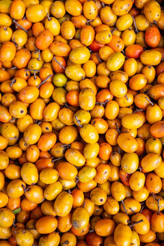Red mombin bunch, or Seriguela in Portuguese, at the wholesale market stall on Sao Paulo city, Brazil