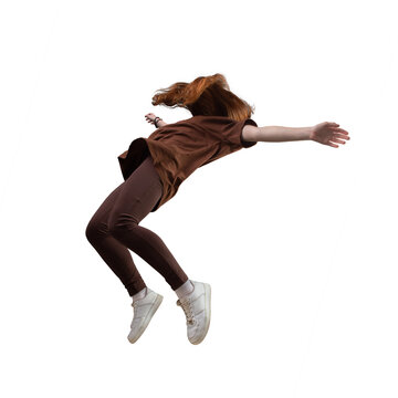 Side view of teen age girl in zero gravity or a fall.