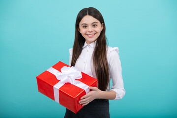 Fototapeta premium Child with gift present box on isolated background. Presents for birthday, Valentines day, New Year or Christmas.