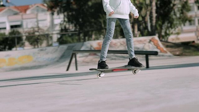 Girl riding on waveboard with two wheels, modern street skate sports of teenagers, casterboard or ripstick for balance ride.