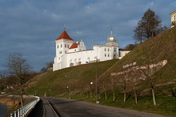 Fototapeta na wymiar Grodno Old Castle (Grodno Upper Castle) on the banks of the Neman River on a sunny day, Grodno, Belarus