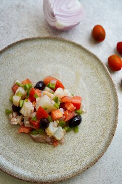 Esqueixada, Cod fish salad with tomato and onion, olives , typical Catalan dish, Barcelona, ,Spain 