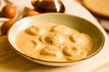 Panzerotti pasta stuffed with pumpkin cooked with sauce. Traditional Italian recipe.