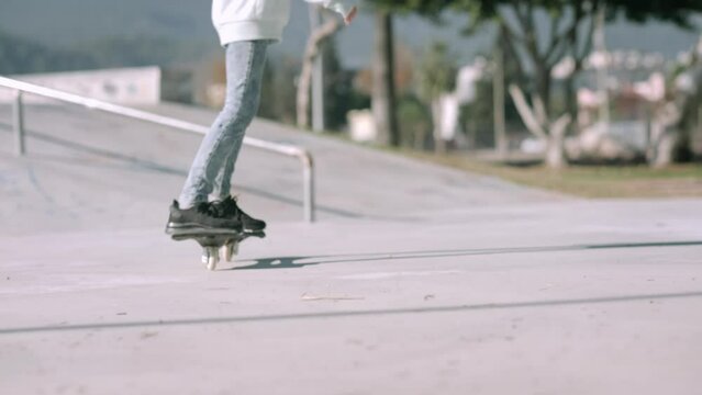 Girl riding on waveboard with two wheels, modern street skate sports of teenagers, casterboard or ripstick for balance ride.