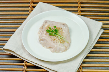 Diet healthy food chicken breast cooked on a white plate on the table